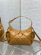 Dior quilted leather shoulder bag with top handle and crossbody strap, gold hardware