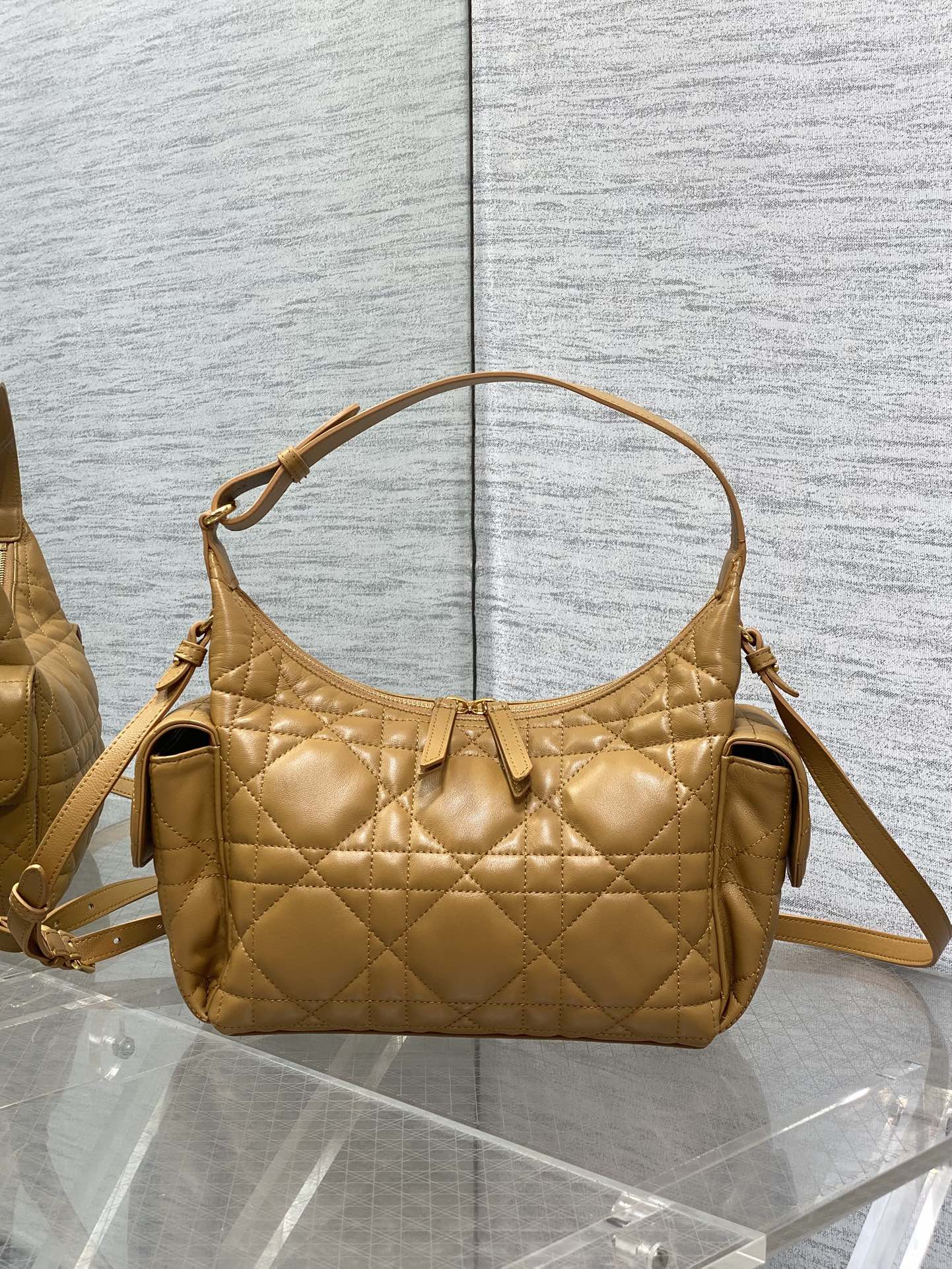 Dior quilted leather shoulder bag with top handle and crossbody strap, gold hardware