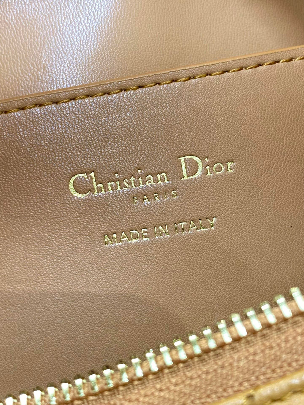 Dior bag leather stamp reading Christian Dior Paris and Made in Italy