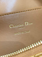 Dior bag leather stamp reading Christian Dior Paris and Made in Italy