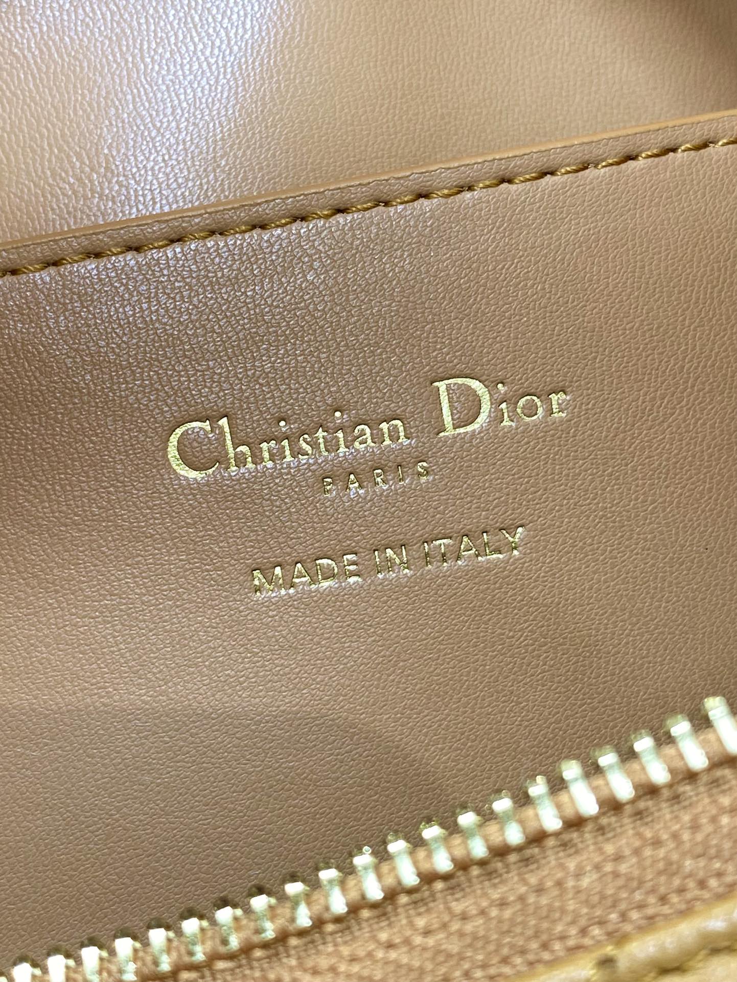 Dior bag leather stamp reading Christian Dior Paris and Made in Italy