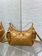 Dior quilted leather handbag with arched top handle and adjustable crossbody strap