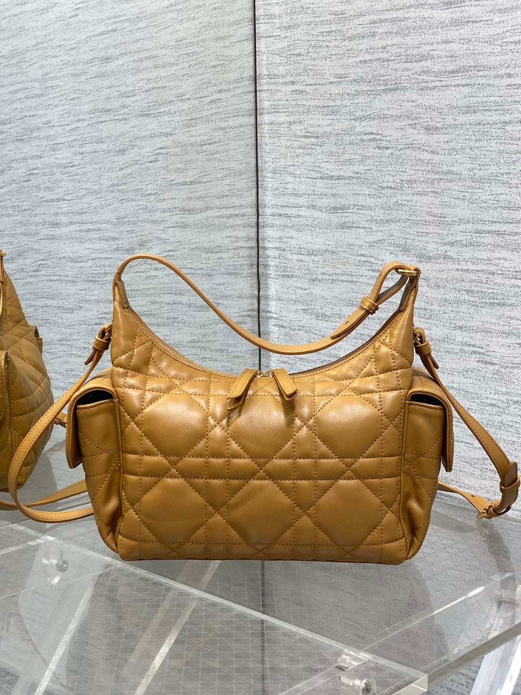 Dior quilted leather shoulder bag with two side tabs and detachable strap