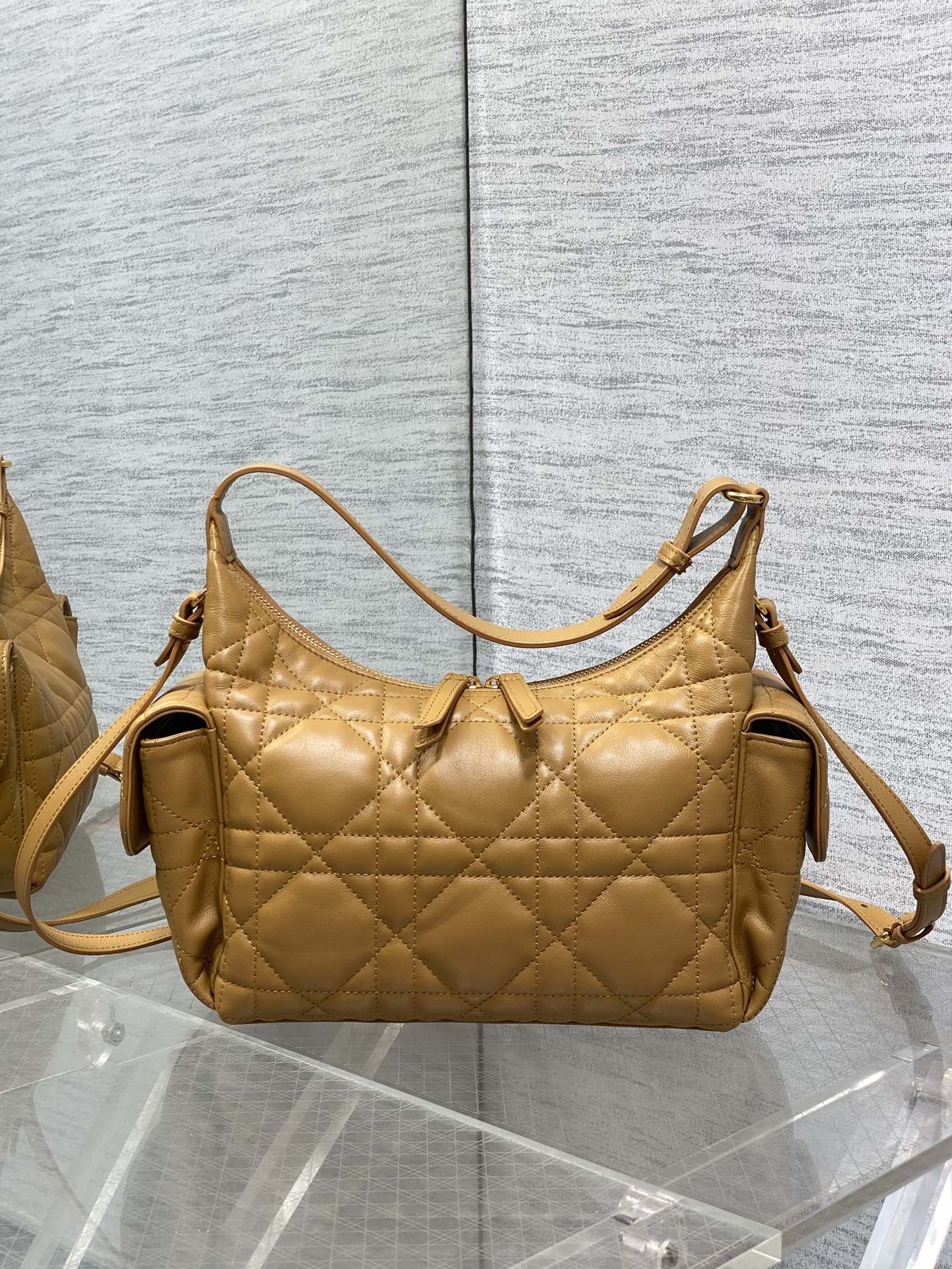 Dior quilted leather shoulder bag with two side tabs and detachable strap