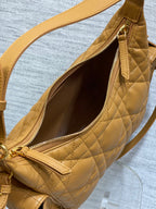 Dior quilted leather bag open view with zipper closure and interior lining