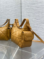 Dior quilted leather mini bag set on display, one with D-ring front and strap