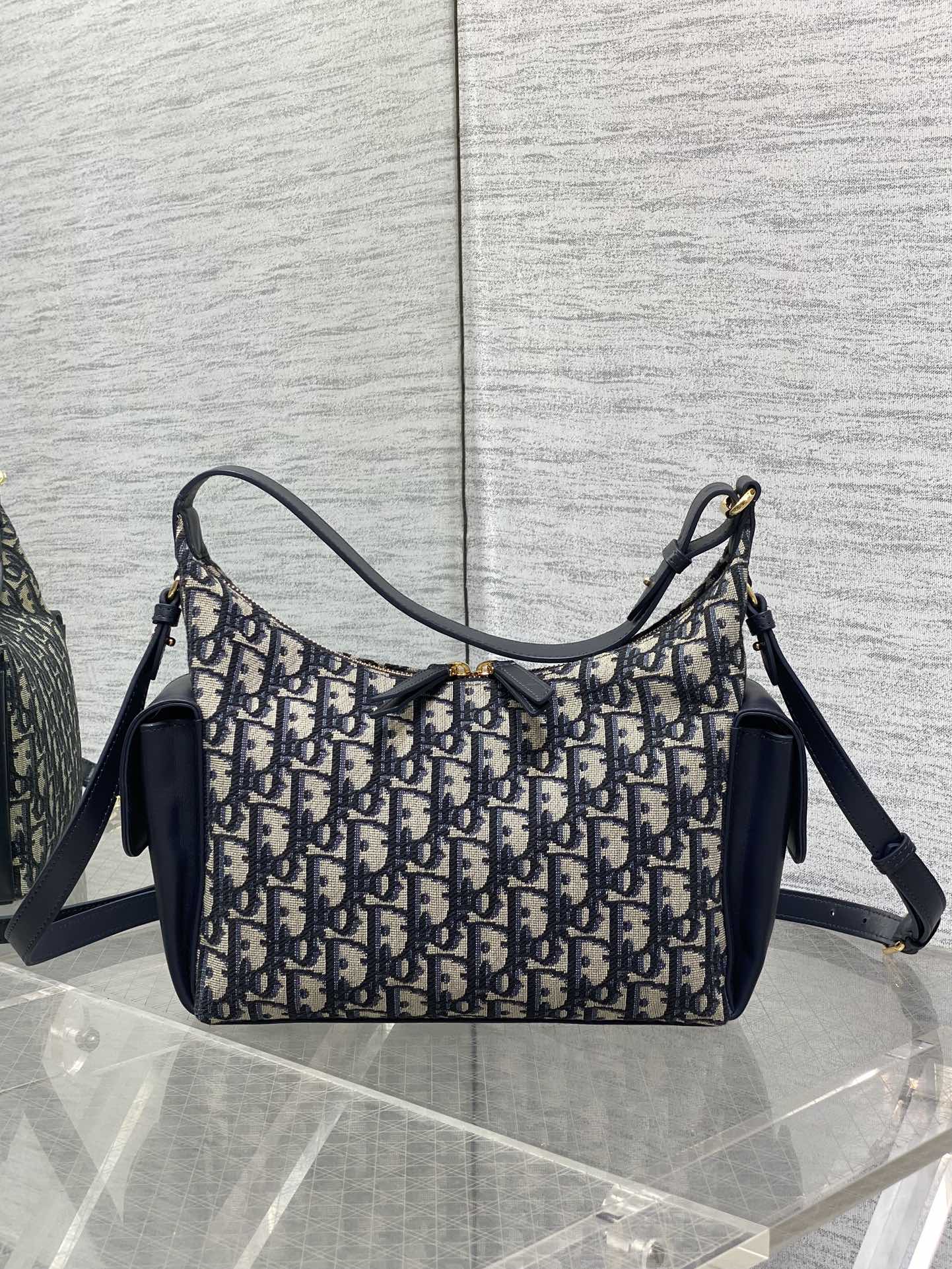 Dior hobo shoulder bag with navy leather shoulder strap and Dior Oblique canvas body