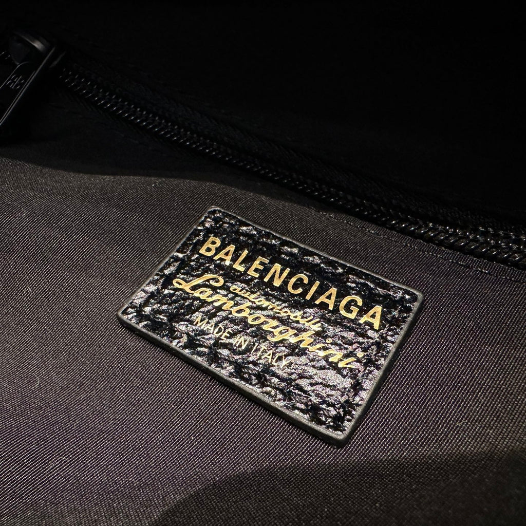 Balenciaga logo label on black interior fabric near zipper