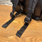 Black fabric shoulder straps with plastic adjustment buckles