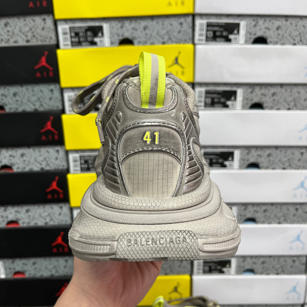 Gray sneaker heel with "BALENCIAGA" and neon yellow striped collar