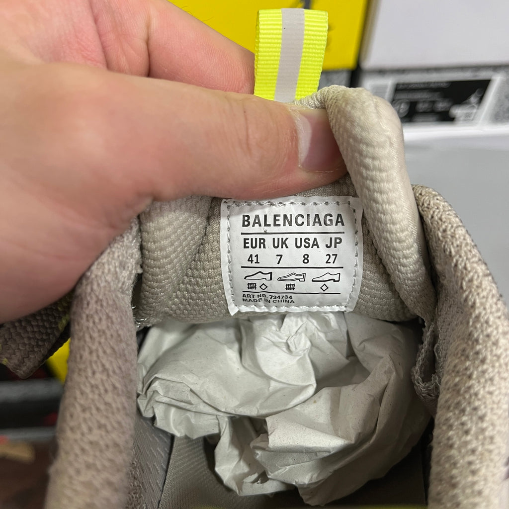 Gray sneaker inner label reading BALENCIAGA with size and sizing codes