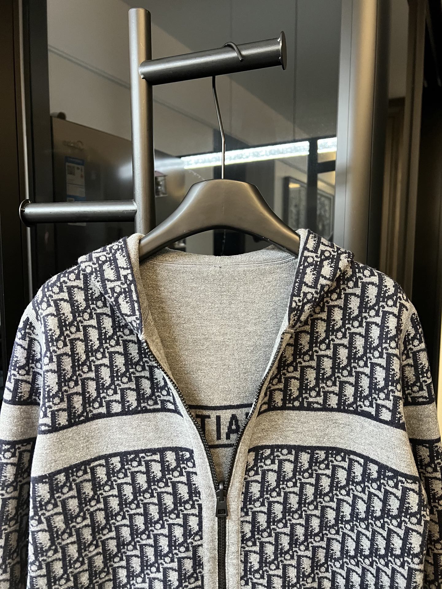 Dior logo knit long cardigan with contrast hood and zip front, close-up