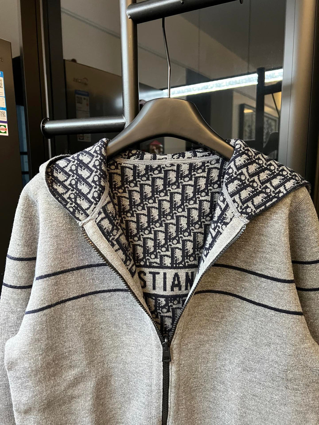 Long cardigan hoodie with heather gray body and black logo knit hood