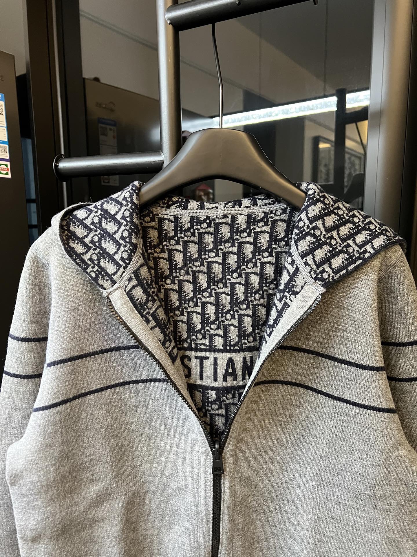 Long cardigan hoodie with heather gray body and black logo knit hood