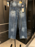 Denim jeans in light blue wash, two front pockets, back patch pockets, button fly