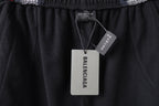 Black Balenciaga track shorts with hang tags at the waistband area