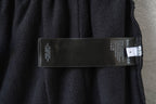 Black Balenciaga track shorts fabric label with size and care information