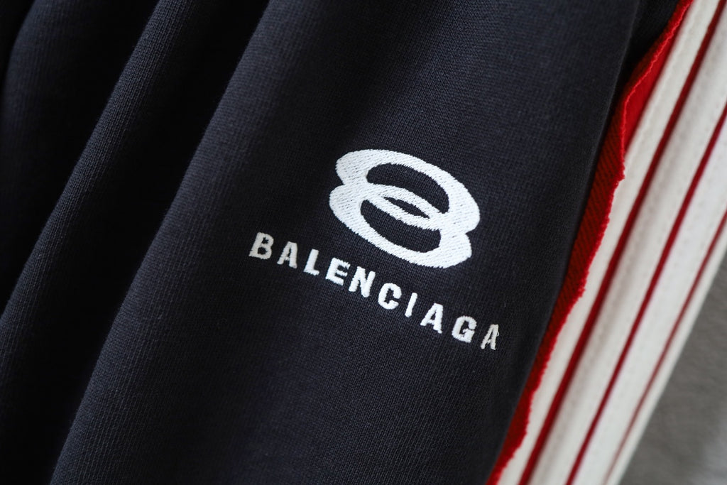Black fabric with BALENCIAGA logo print and red/white side stripe trim