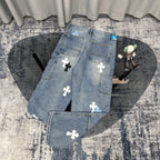 Light blue denim pants with cross applique patches and back pocket detail