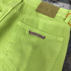 Lime green pants showing waistband label area and front pocket stitch lines
