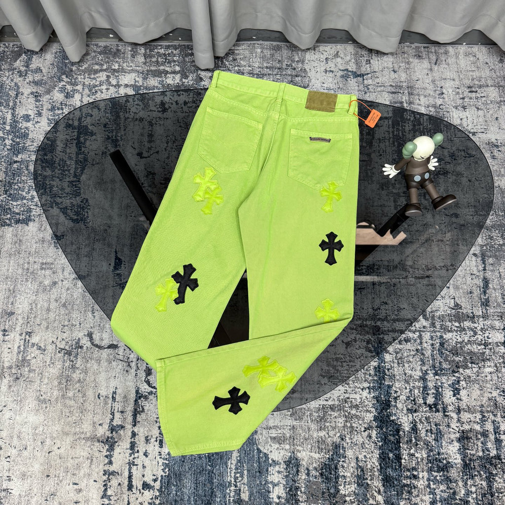 Neon lime green pants with cross appliques, zip fly, front pockets, belt loops