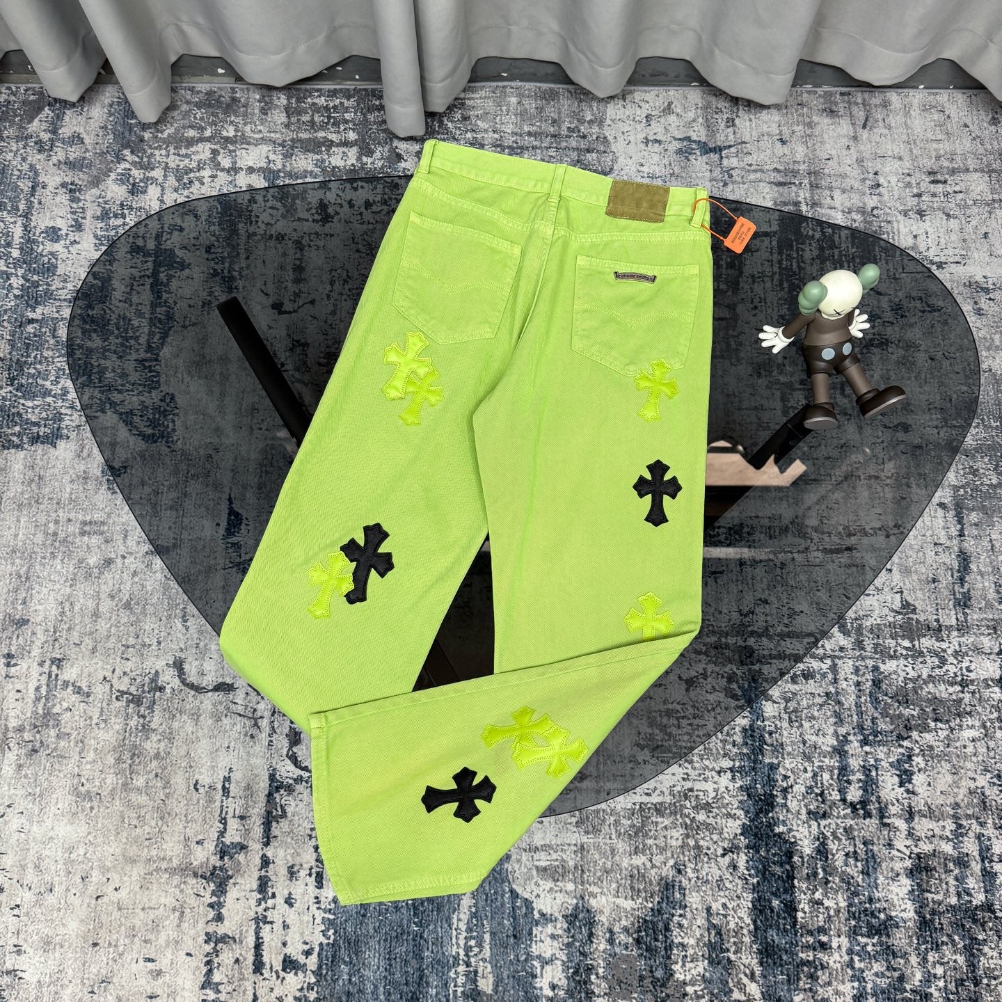 Neon lime green pants with cross appliques, zip fly, front pockets, belt loops
