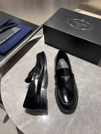 Prada unisex black patent loafers with chunky outsole, heel side view