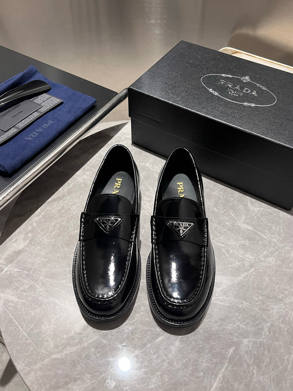 Prada unisex black patent loafers with triangular logo strap