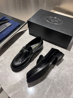 Prada unisex black patent loafers with thick sole and logo strap