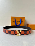 Louis Vuitton belt with orange and brown check strap and gold-tone LV buckle.