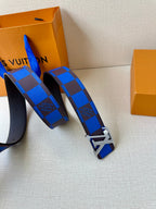 Louis Vuitton belt laid out with blue check strap and LV logo metal buckle.