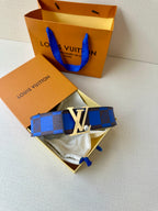 Louis Vuitton belt with blue check strap and gold-tone LV buckle on pouch.