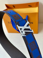 Louis Vuitton belt close-up: blue check strap with silver-tone metal buckle.
