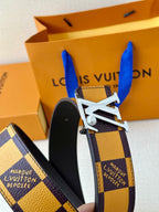 Check-pattern belt detail with silver-tone buckle and dark leather backing