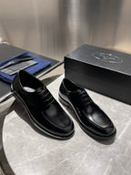 Unisex black leather lace-up shoes, side profile with black laces and thick sole