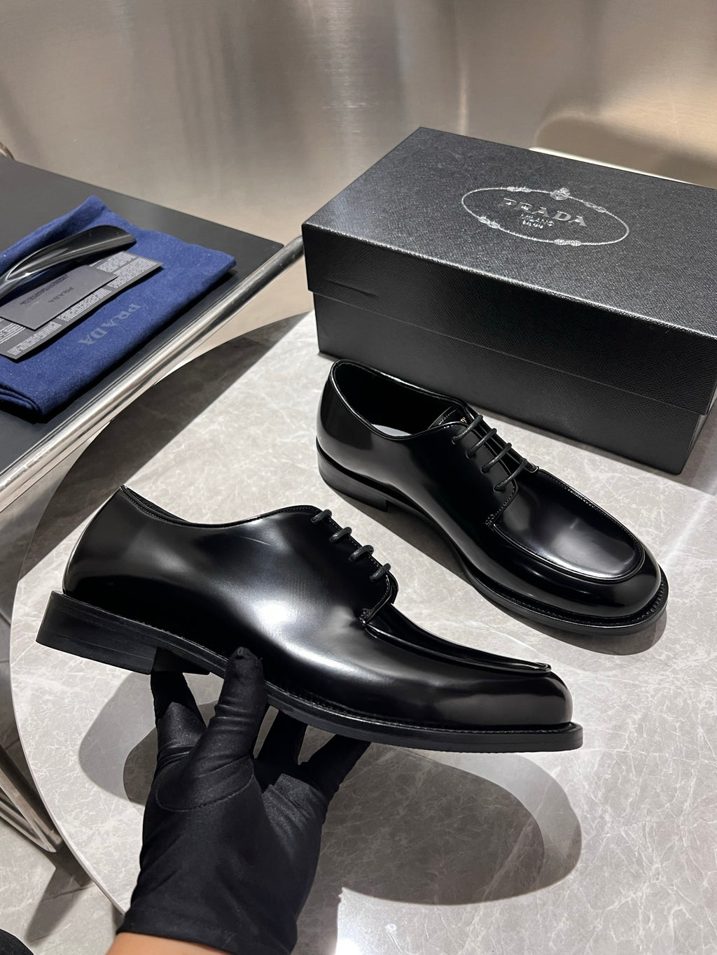 Unisex black leather lace-up shoes with chunky sole and heel, pair shown