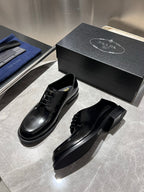 Unisex black leather lace-up oxford shoes with box, pair shown from side