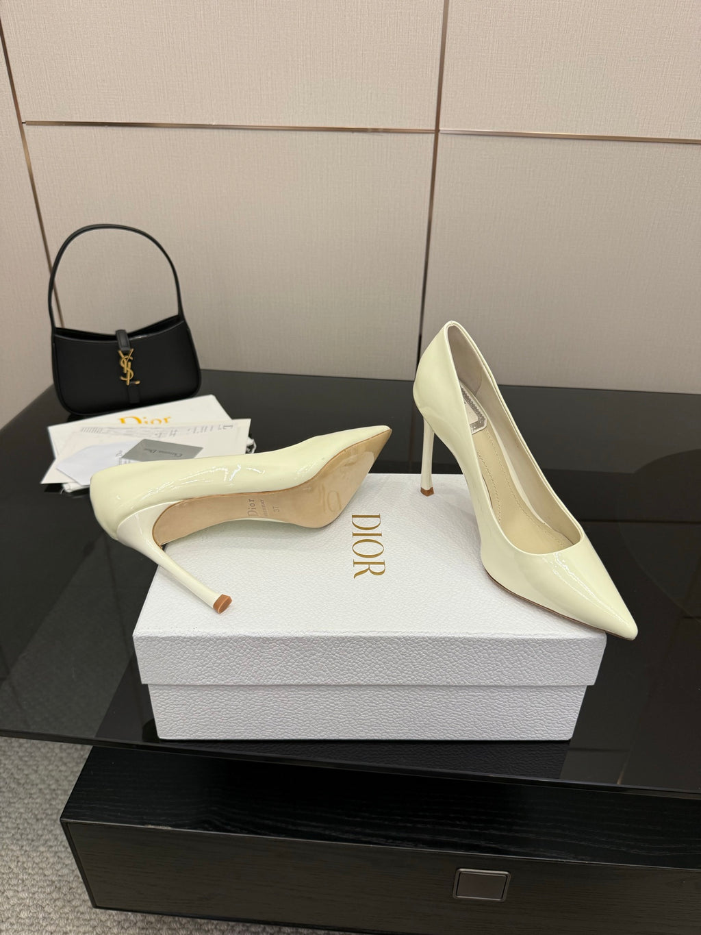 Dior women’s pointed-toe pumps, light yellow, one shoe profile with high stiletto heel