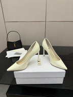 Dior women’s pointed-toe pumps, light yellow, angled view with high stiletto heel