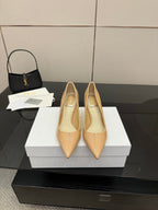 Beige patent pointed-toe pump with slender stiletto heel