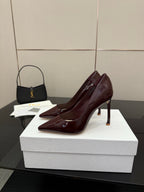 Burgundy patent leather pointed-toe stiletto pumps, angled side view