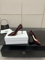 Burgundy patent leather pointed-toe stiletto pumps, heel-to-arch profile