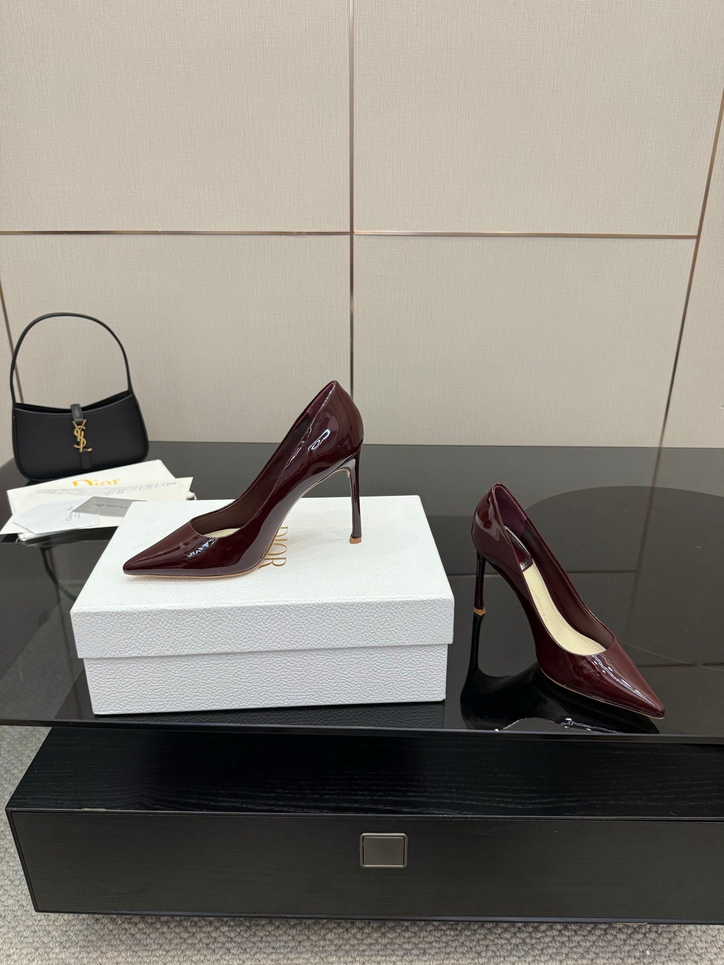 Burgundy patent leather pointed-toe stiletto pumps, heel-to-arch profile