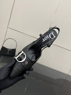Black Dior slingback pump close-up, pointed toe, silver buckle strap