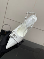 White slingback heel shoe with ankle strap buckle and pointed toe