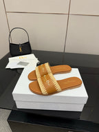 Dior slide sandals with beige braided straps on white shoebox