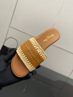 Dior slide sandal close-up in hand, caramel leather and beige braided strap