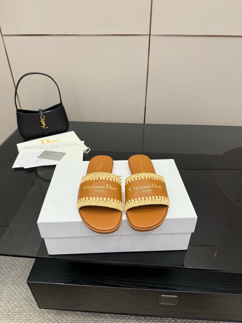 Dior slide sandals with beige braided strap, plus small black Dior handbag