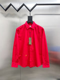 Red long-sleeve button-up shirt with front placket and chest detail