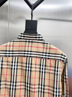Plaid button-up shirt with spread collar and yoke in beige, red, and navy checks